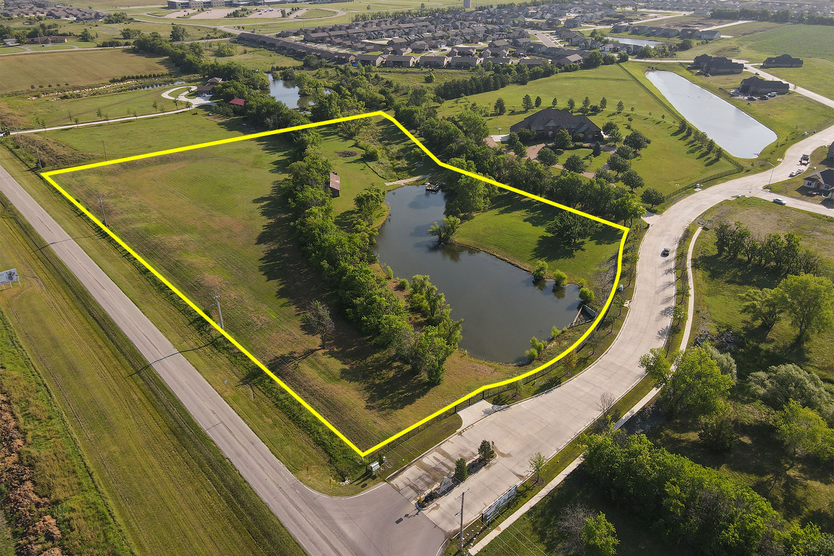 (Bel Aire) ABSOLUTE 7.94± Acres With Pond Zoned Commercial Or